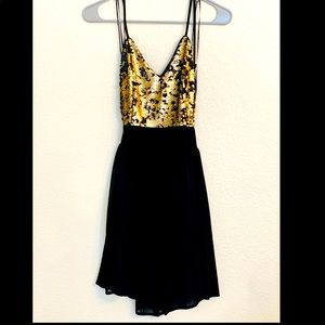 PromGirl dress. Never worn. The back is cut out and flows nicely. Short and fun!